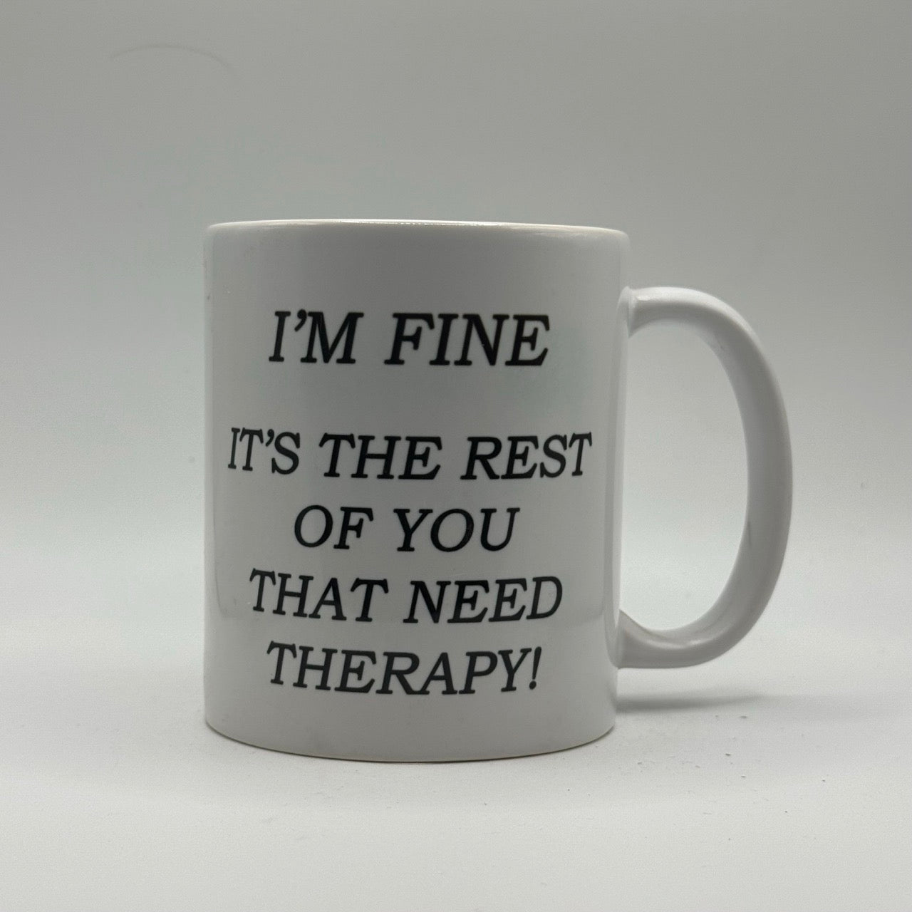 I’m Fine, It’s the Rest of You That Need Therapy – White Ceramic Coffee Mug (11oz)